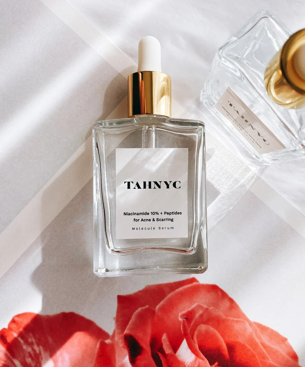 TAHNYC acne and scarring serum styled with rose-toned flatlay – The Pharmacy Lab