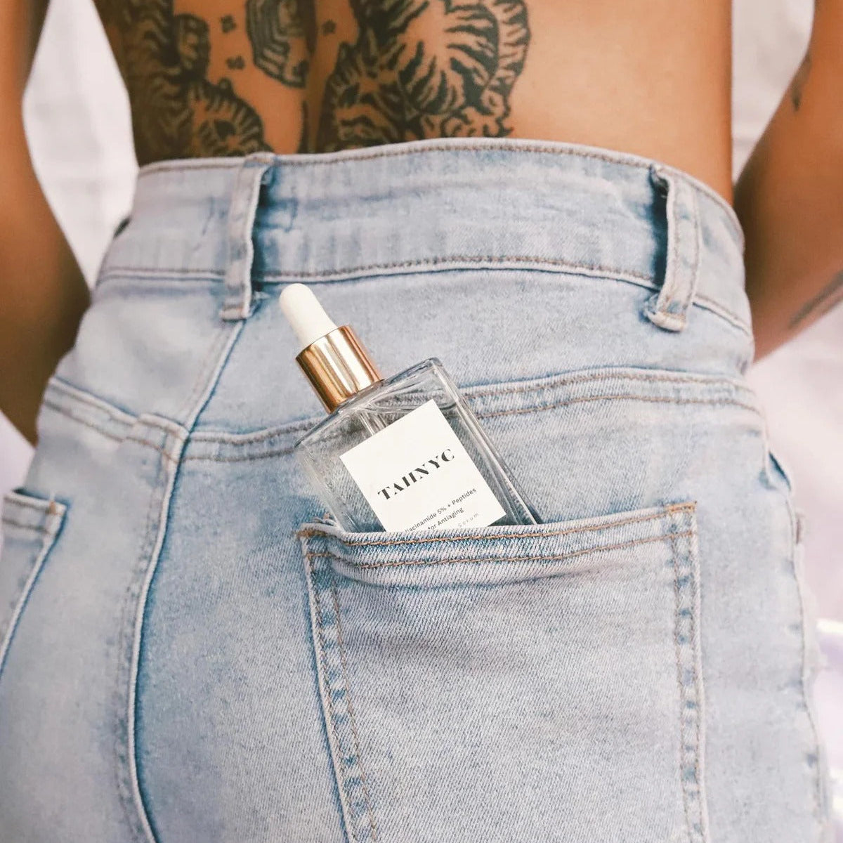 TAHNYC Niacinamide 5% + Peptides Serum flatlay over editorial background – The Pharmacy Lab