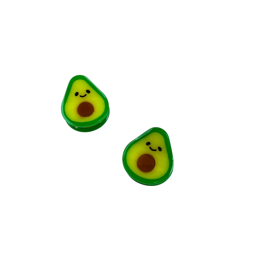 Two avocado-shaped earrings with smiling faces on a white background