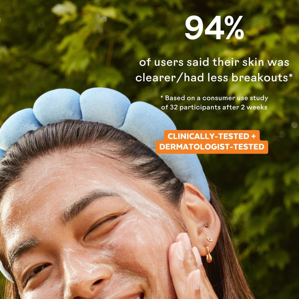 Woman applying skincare product with text about skin clarity and breakouts