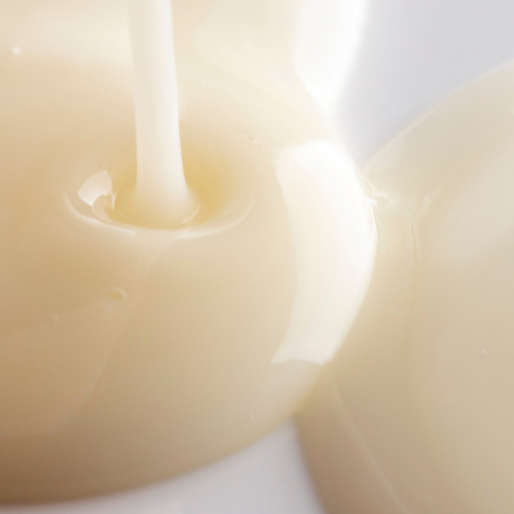 Close-up of a candle with a soft focus on a white background