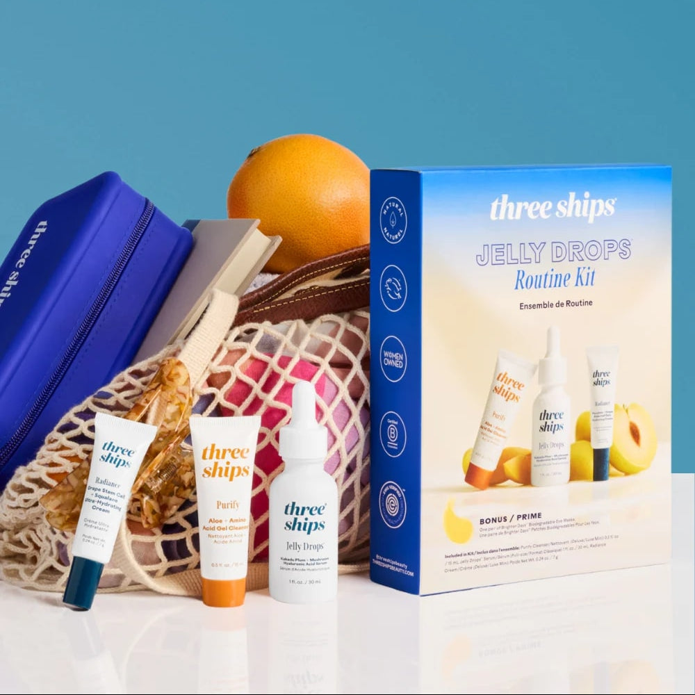 Three Ships Jelly Drops Routine Kit with products and an orange on a blue background