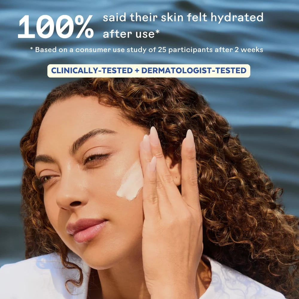 Woman applying cream to her face with a water background, indicating hydration benefits.