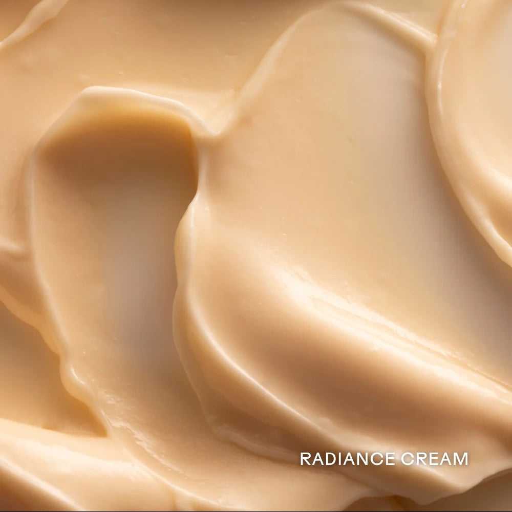 Close-up of creamy beige texture with 'Radiance Cream' text