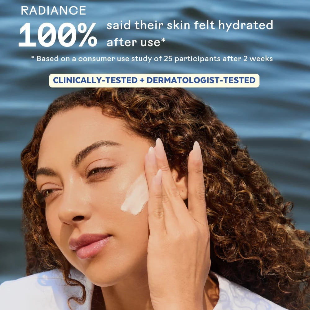 Woman applying skincare product with water in the background