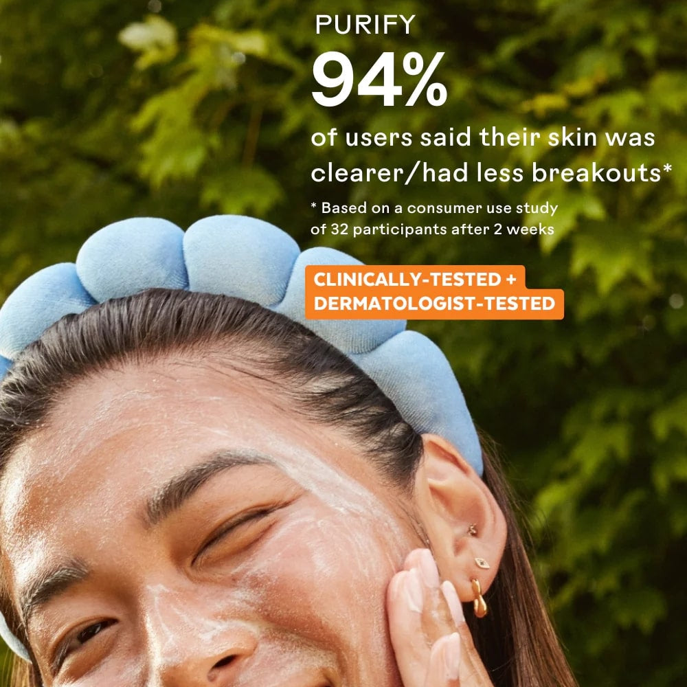 Person applying a skincare product with text about skin clarity and breakouts.