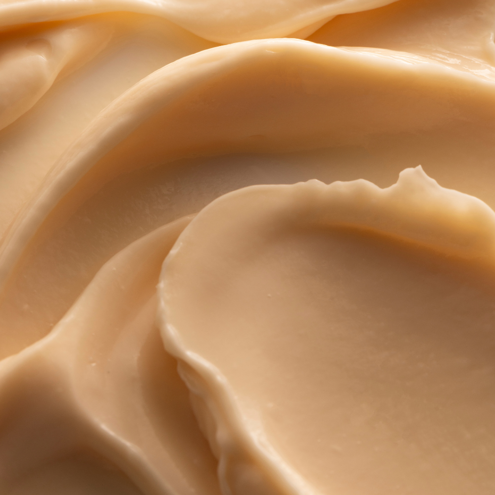 Close-up of smooth, beige-colored cream or cheese