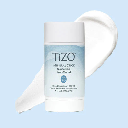 Tizo mineral stick sunscreen on a light blue background