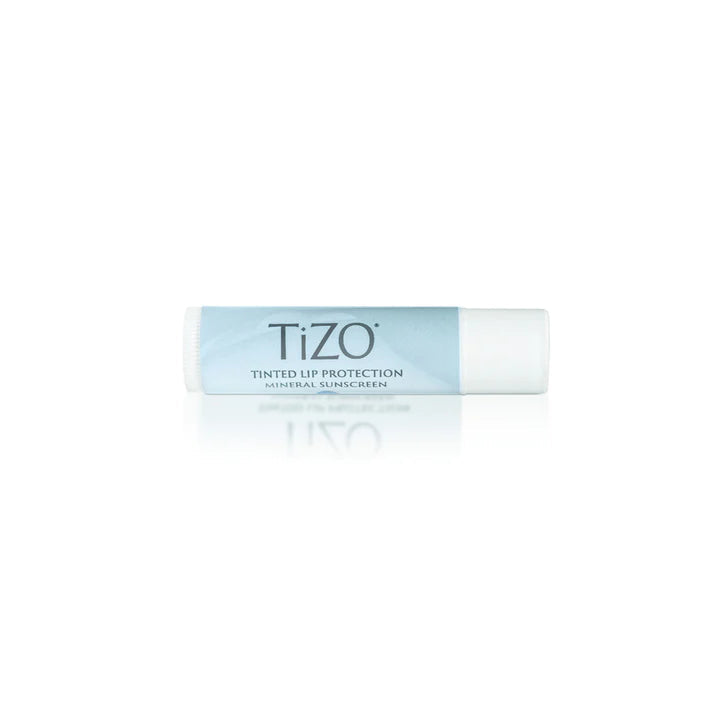 Tizo lip balm with wooden applicator on a white background