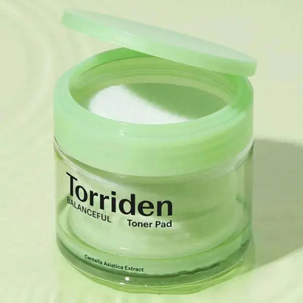 Torriden Balanceful Toner Pad container with green lid on a white background