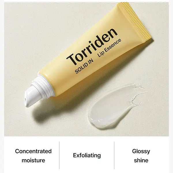 Torriden Solid IN Lip Essence tube with a smear of product on a beige background