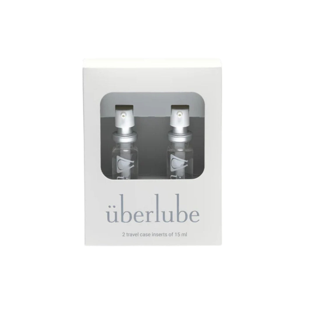 Two travel case inserts of überlube in a clear window box on a white background