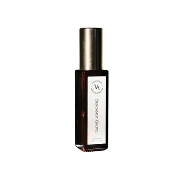 Bottle of Bergamot Grove essential oil on a white background