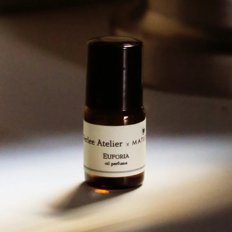 Perlee Atelier x MATISSE Euforia oil perfume bottle on a neutral background