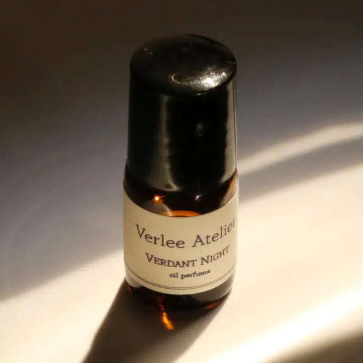 Small bottle of Verlee Atelier Verdant Night oil perfume on a white background