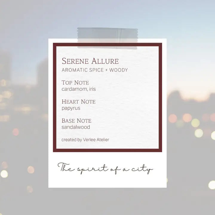 Product label for 'Serene Allure' with notes on fragrance notes and brand name, against a blurred cityscape background.