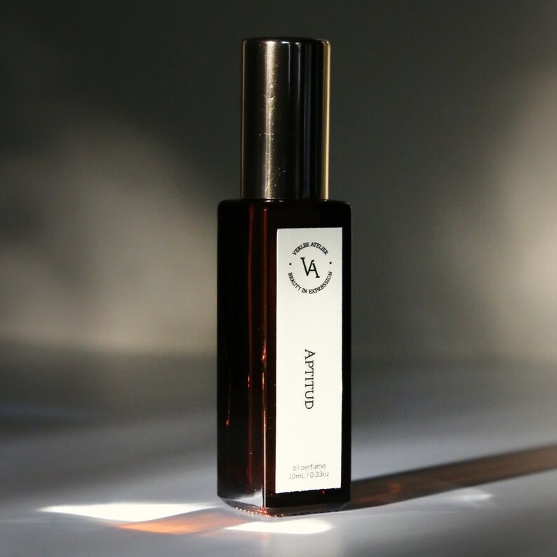 Black bottle with a white label on a white background