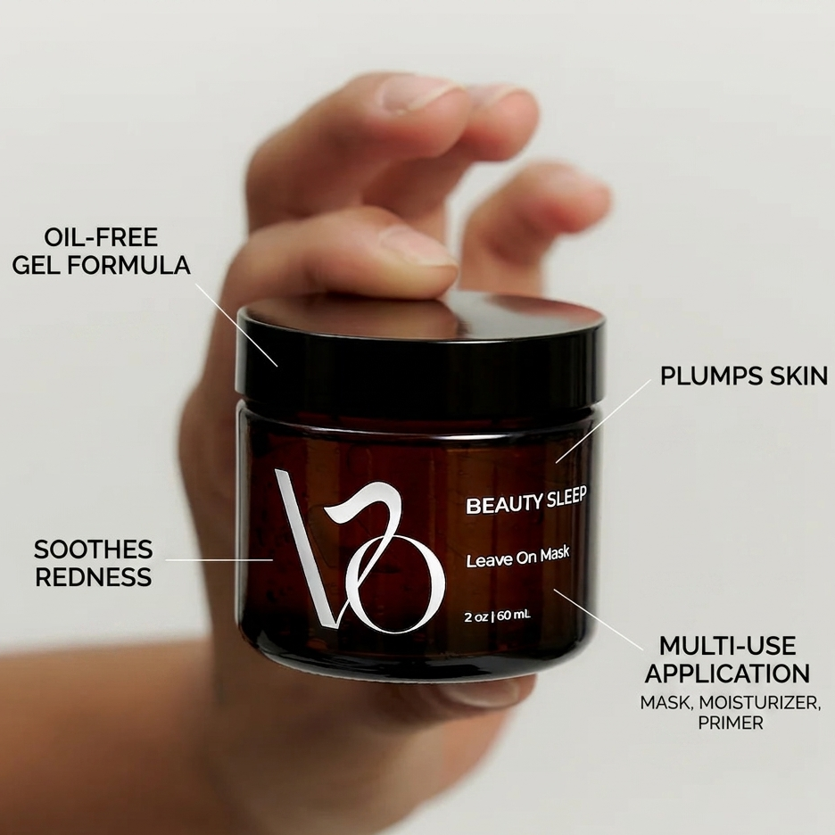 Hand holding a jar of 'Beauty Sleep' leave-on mask with benefits labels on a light gray background