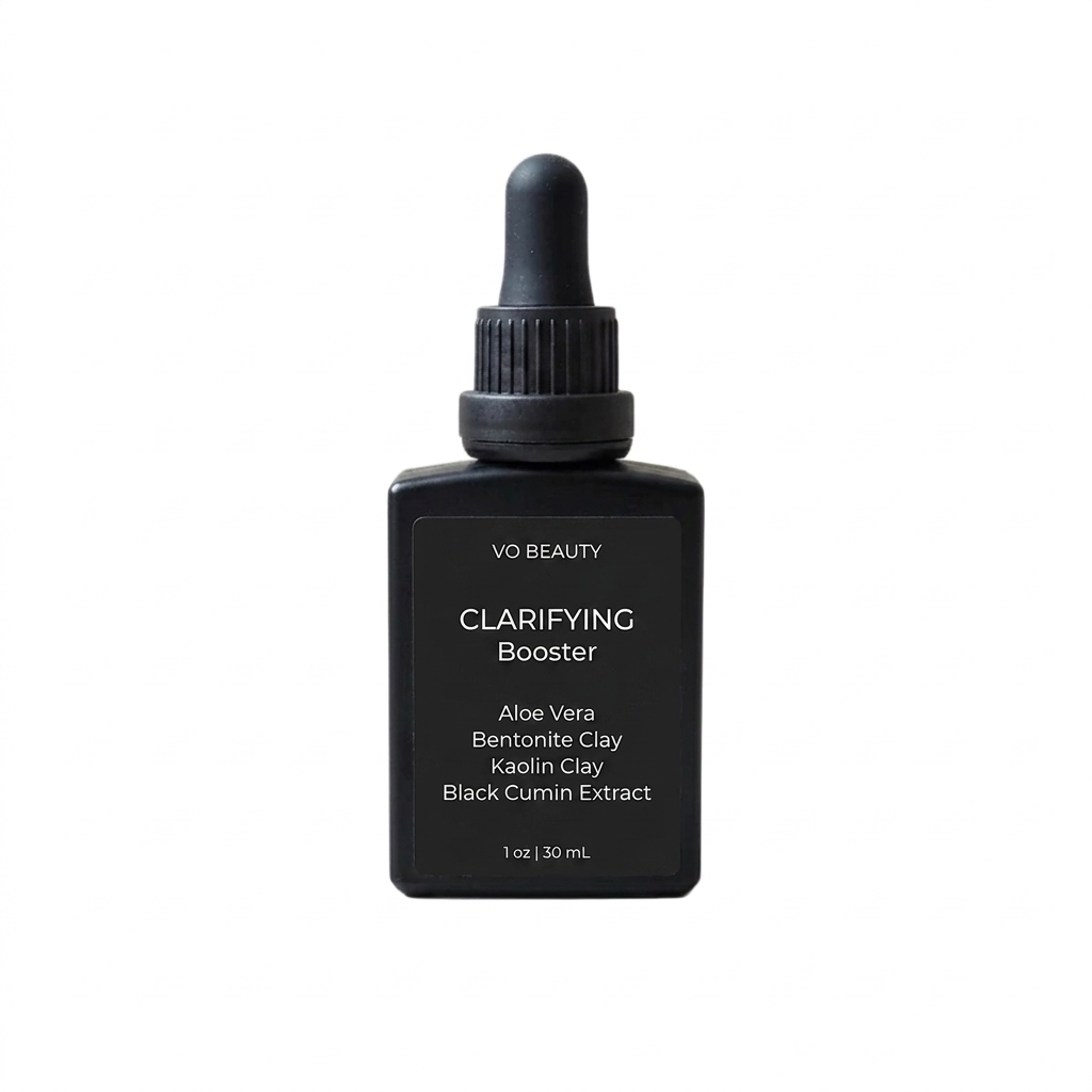Black bottle of VO Beauty Clarifying Booster with dropper on a white background