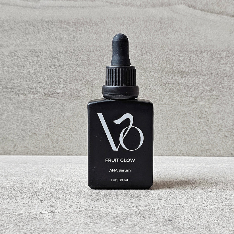 Black serum bottle with dropper labeled 'V30' on a white background