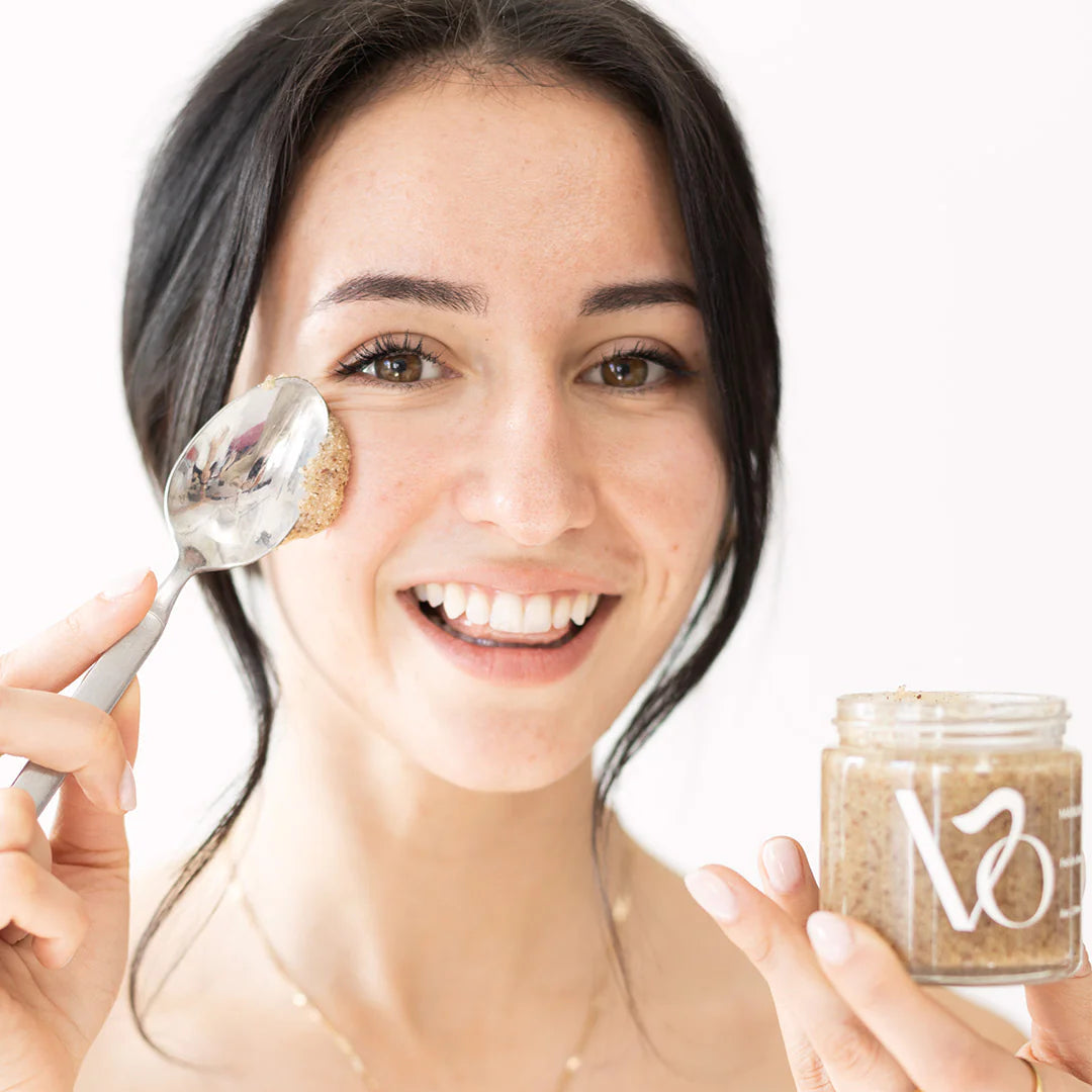 Jar of Manuka Glow Polish Bean Mask with black lid on a white background